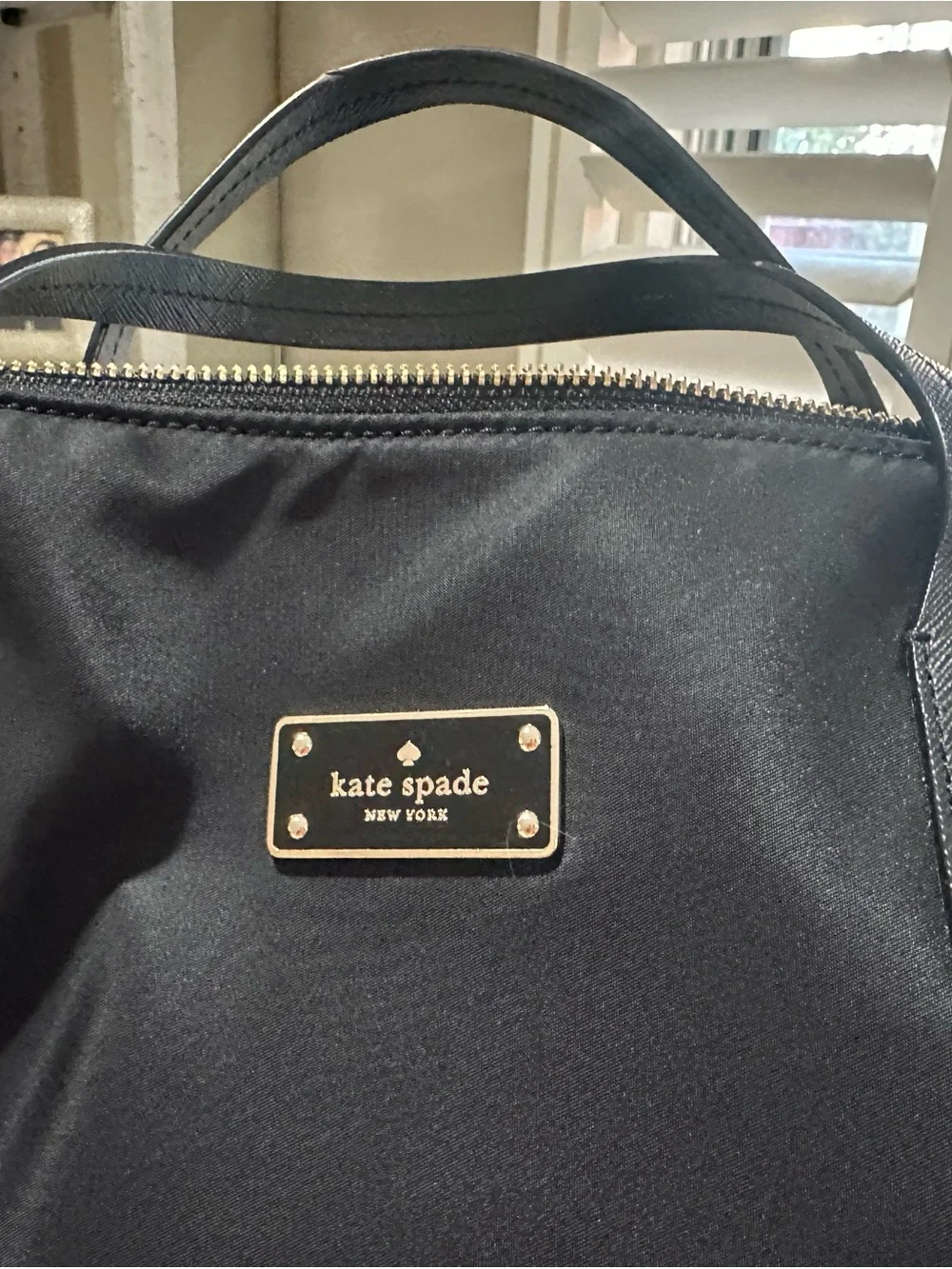 kate spade black nylon duffel with gold hardware